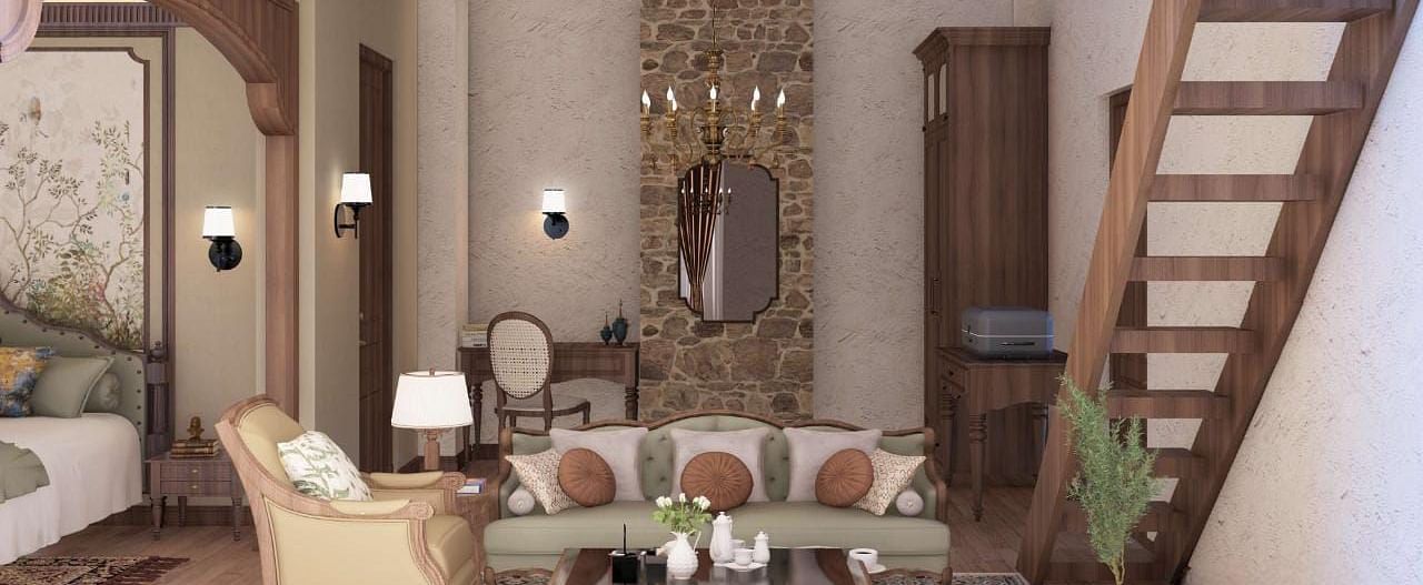 A cosy living room has a stone feature wall, a sofa, and an armchair, with a wooden staircase leading upstairs - BluSalzz Escapade Resort, Dalhousie 