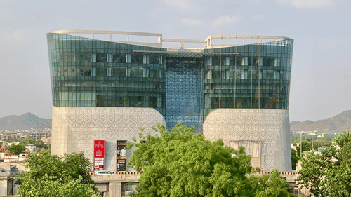 An aerial view of our hotel surrounded by lush greenery seen during a sunny day - Sarovar Portico, Ajmer 