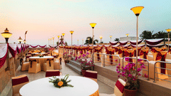 Overview of the seating arrangement on the Rooftop banquet Hall at Hotel Ramada Plaza Palm Grove.