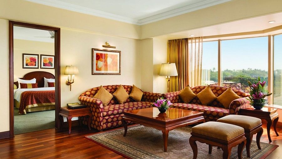 seating area in the Deluxe Suite at Hotel Ramada Plaza Palm Grove Juhu Beach