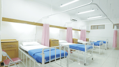 Hospital beds arranged inside the hospital