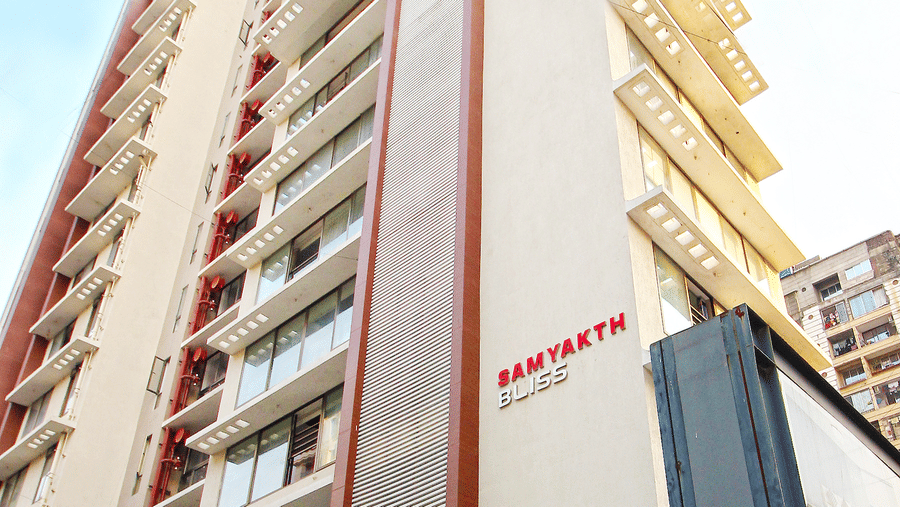 Exterior facade as viewed from below with the blue sky in the background of Theory9, Khar.