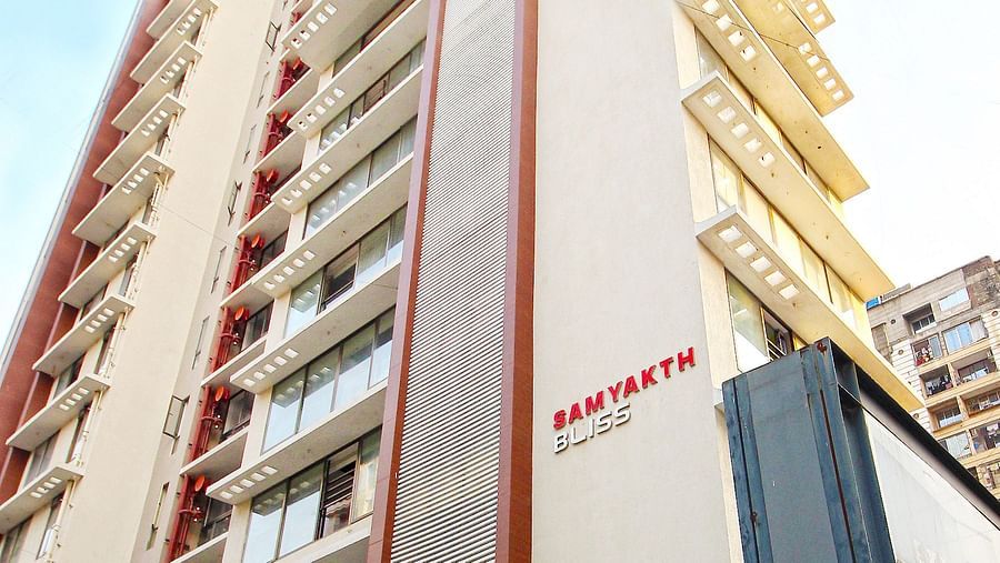 exterior facade as viewed from below with the blue sky in the background - theory9 khar