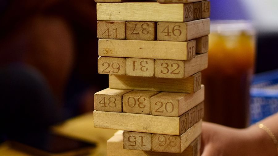 people playing jenga