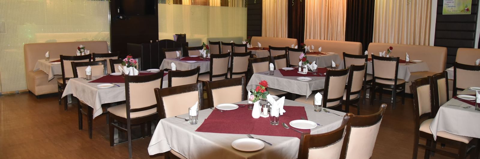 Image of the restaurant with dining spoace and ballons on the ceiling