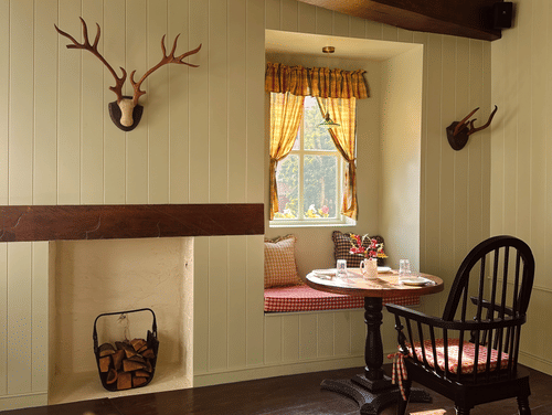 A table placed next to the next as the chair is facing the window at Old England Cafe - Hotel Atulyaa Taj, Agra