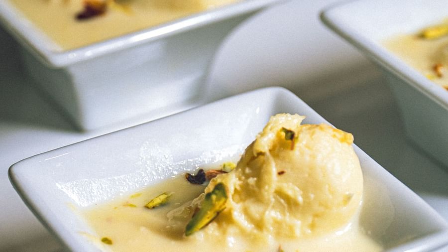 Small, square dishes filled with a light-colored dessert, arranged on a tray.