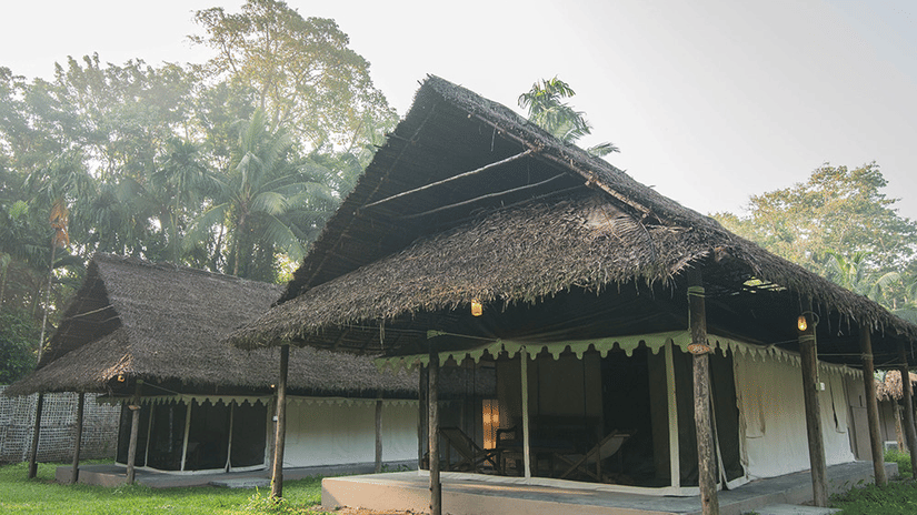 Exterior facade of Tented cottages with a garden in front of it at Barefoot at Havelock.