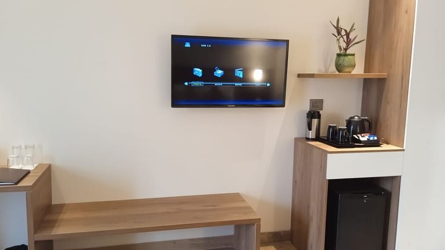 bedroom amenities like a flat-screen television, a tea & coffee maker, an in-room safe and more for a comfortable stay