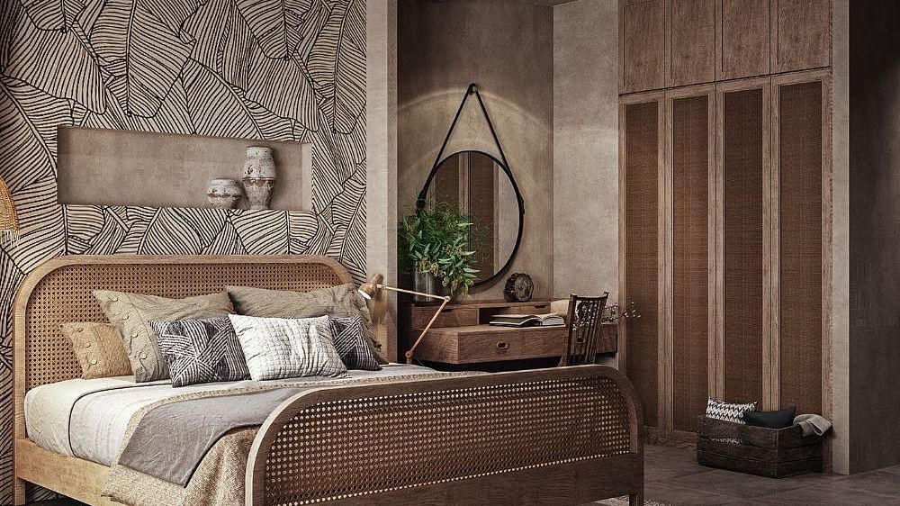 A spacious room featuring a large bed and a wall-mounted cupboard to the side at The Evren, Vagator.