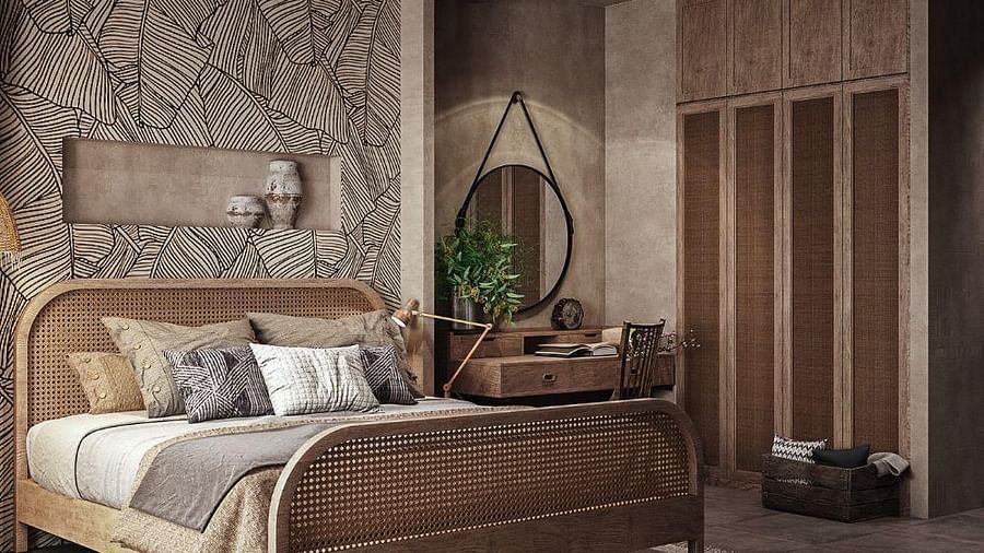 A spacious room featuring a large bed and a wall-mounted cupboard to the side at The Evren, Vagator.