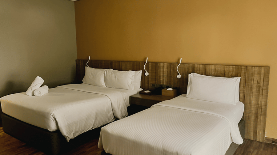 Spacious room with twin beds at Lamari Siargao