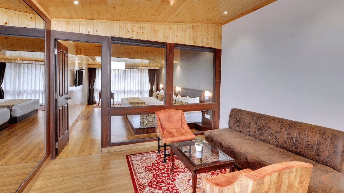 An image of a room with sofa sets, centre table and minimal decoration - Sumitel Vista TV Tower