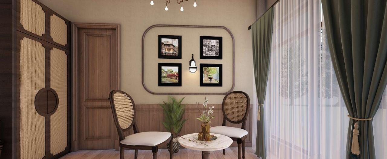 A charming sitting area with two chairs, a small table, and a wardrobe, accented by framed pictures and a chandelier - BluSalzz Escapade Resort, Dalhousie