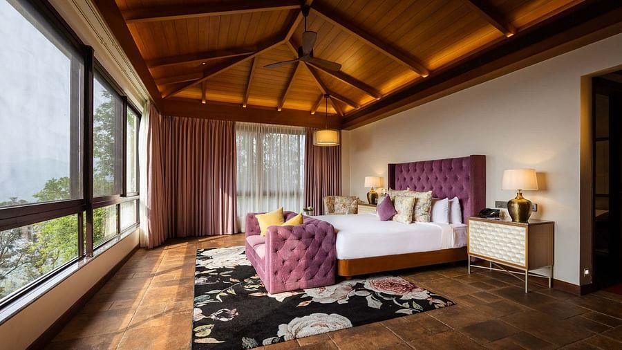 Spacious pink bedroom with lamps at Golak by Denissons Presidential Villa