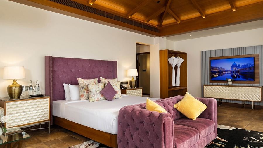 Spacious pink bedroom with lamps at Golak by Denissons Presidential Villa
