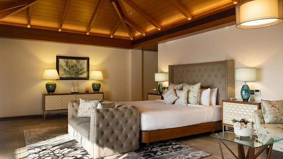 Spacious bedroom with lamps at Golak by Denissons Presidential Villa