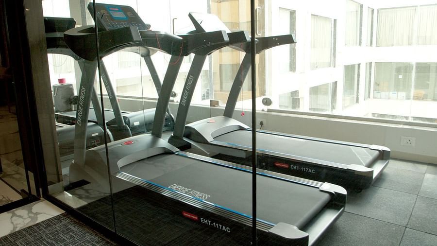 two treadmills inside a gym - Mastiff Hotel, Ankleshwar