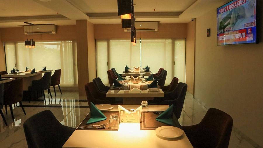 closer view of dining area with soft lighting on top for a peaceful dining experience -Mastiff Hotel, Ankleshwar