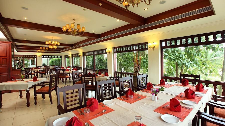 Dining area with tables set with cutlery, ready for the food to be served