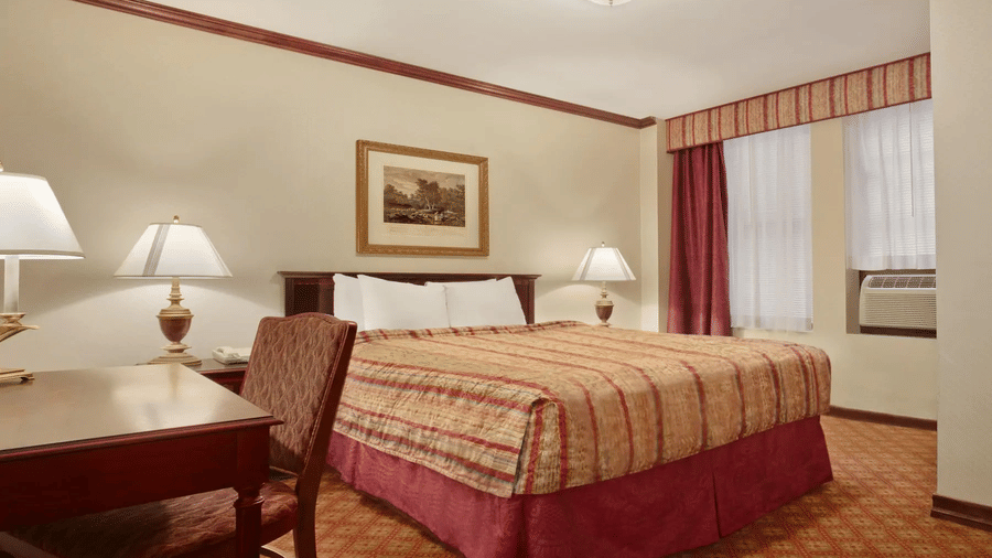 Large room with a bed and workdesk