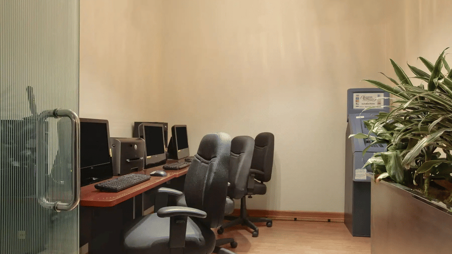 business centre with computers and chairs