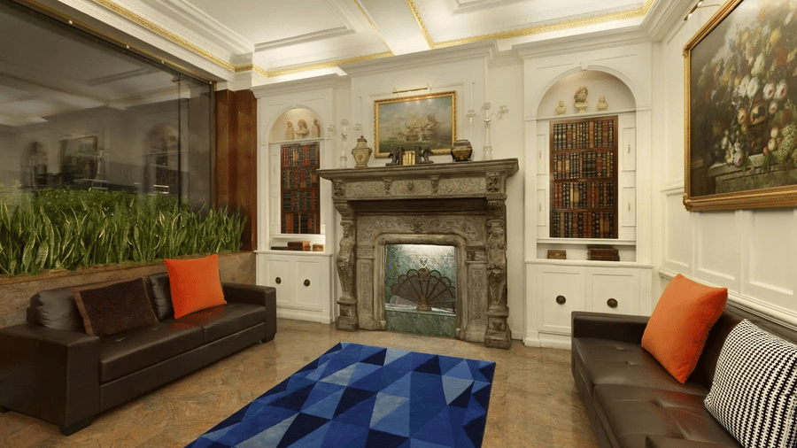 Lounge area with sofas armchairs decorative cushions fireplace framed artwork patterned rug and warm indoor lighting.