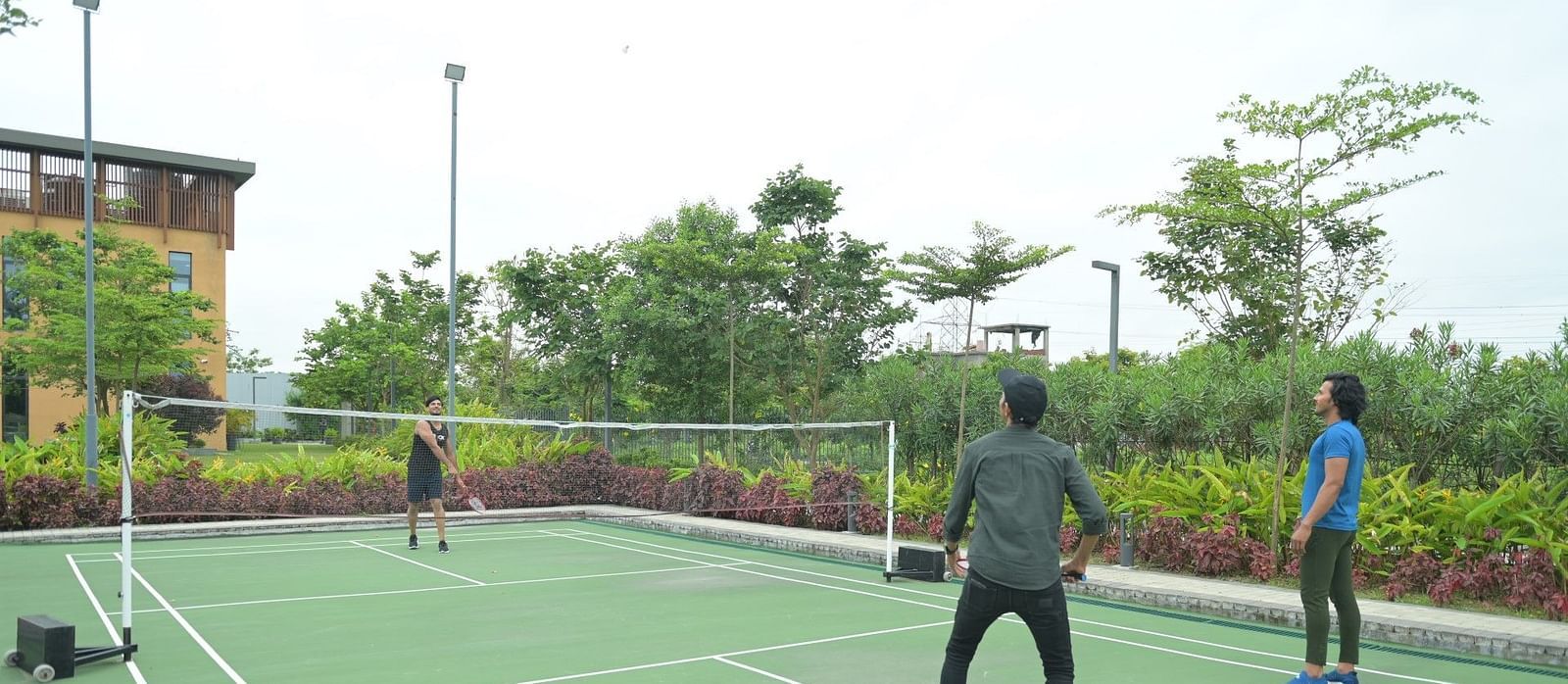 People playing badminton at Singalila Club