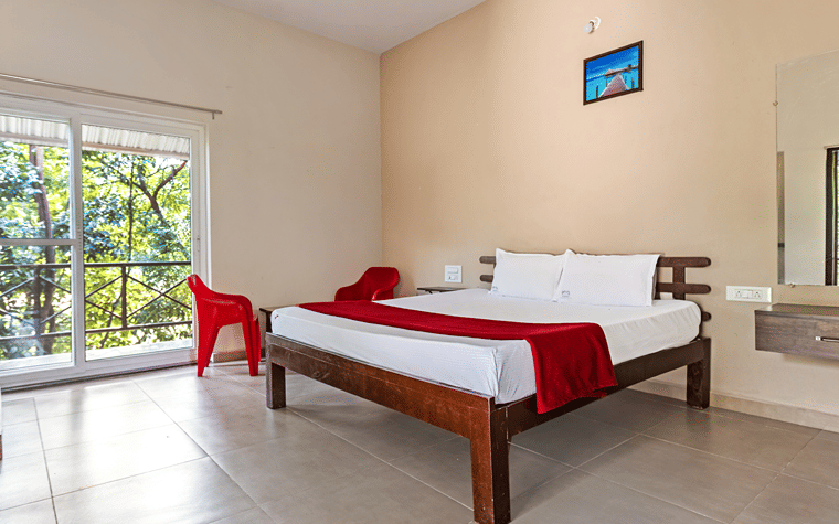 Interior of a classic room at Nature Trails Ashoka Resort Hampi