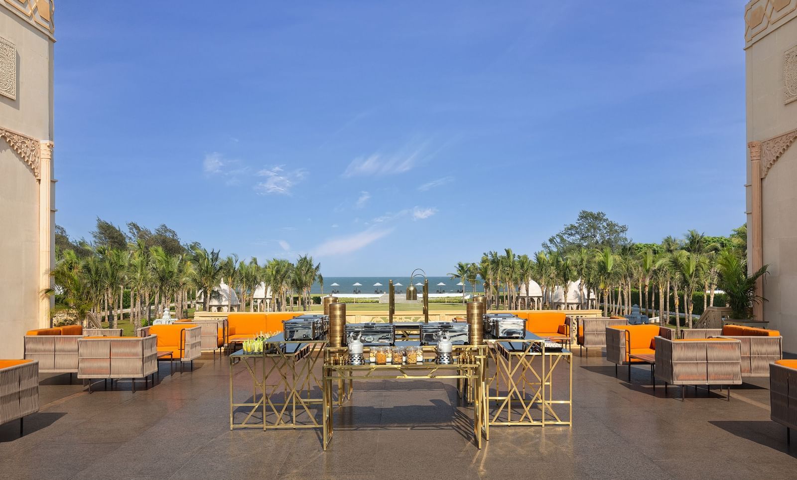The high tea place at our resort in Mahabalipuram offering cosy orange chairs, a snack counter, and views of the Bay of Bengal – Kaldan Samudra Palace, a stunning luxury resort in ECR