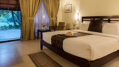 A well-furnished hotel room in Abad Turtle Resort, Marari Alleppey, an Alappuzha beach resort featuring a neatly made double bed