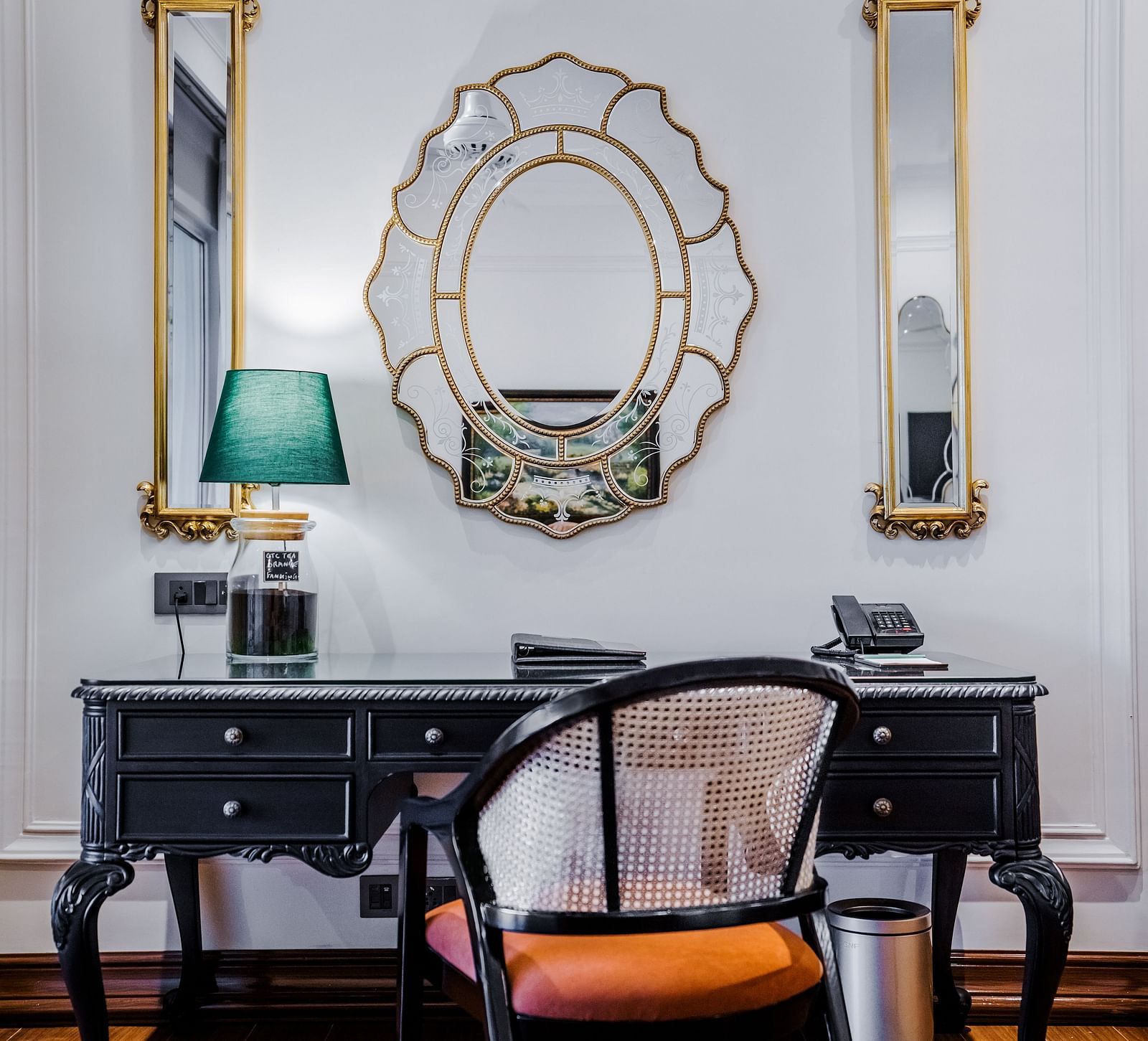 a work station and a mirror above it hanging on the wall - Mayfair Tea Resort, Siliguri 1