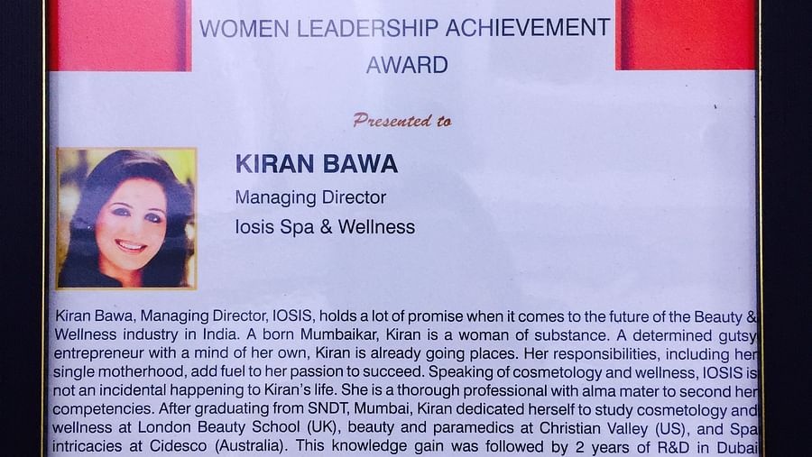 a frame picture of Women's Leadership Award given to kiran bawa - IOSIS Spa & Wellness