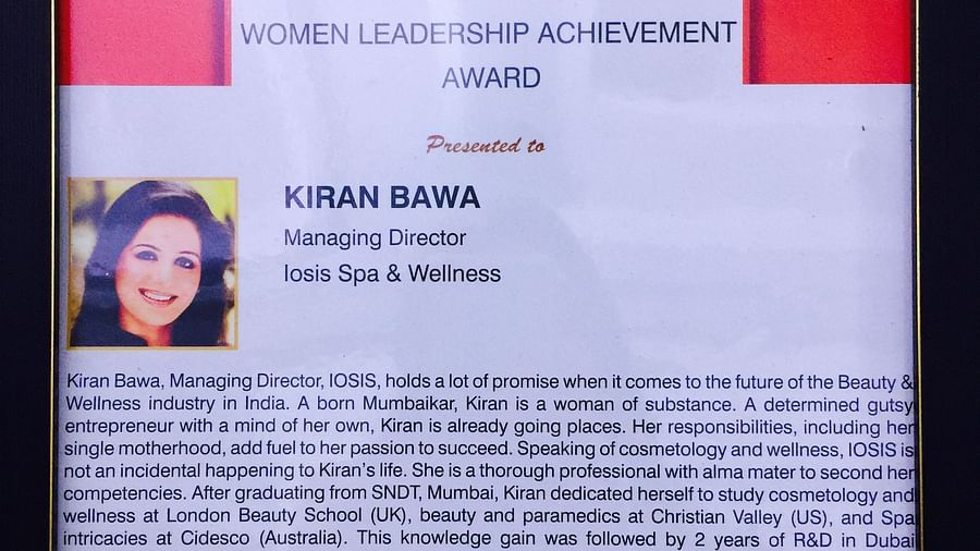 a frame picture of Women's Leadership Award given to kiran bawa - IOSIS Spa & Wellness