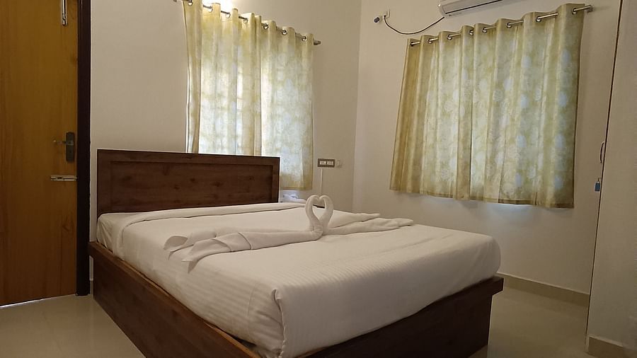 Side view of a double bed at One Bedroom Apartment at le poshe luxury