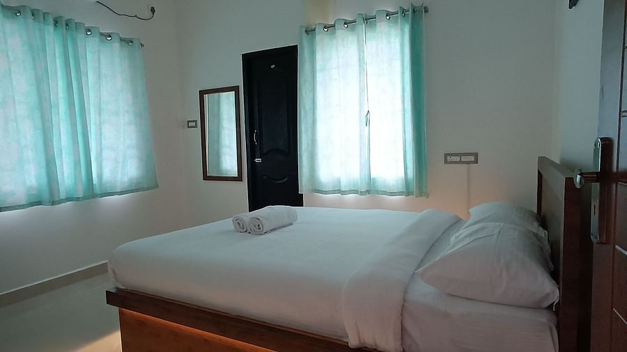 Side view of a double bed at One Bedroom Apartment at le poshe luxury