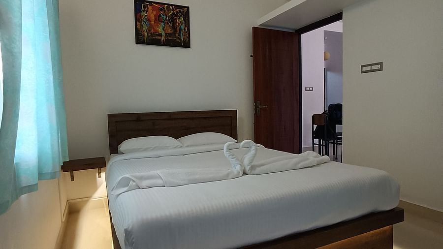 Side view of a double bed at One Bedroom Apartment at le poshe luxury