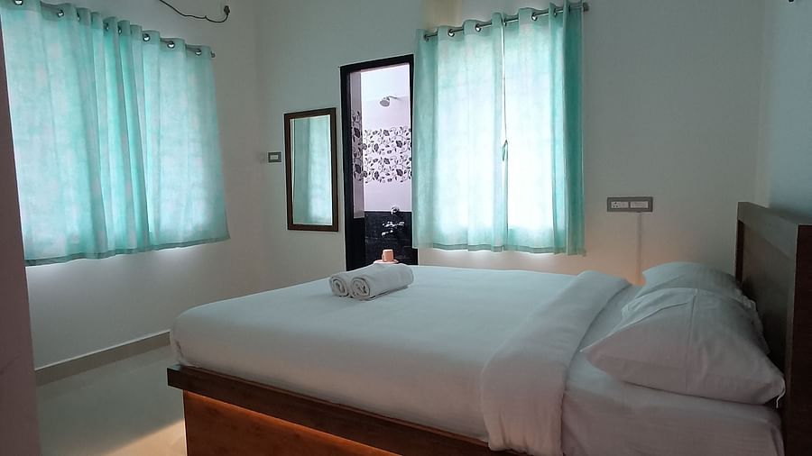 Side view of A double bed at One Bedroom Apartment at le poshe luxury