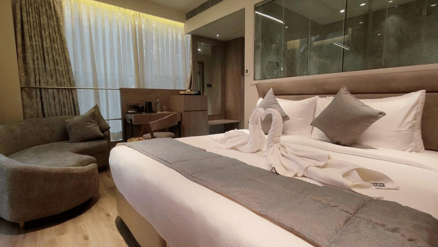 A comfortable Suit Room with a plushy bed at Maxxvalue Hotel, MIDC