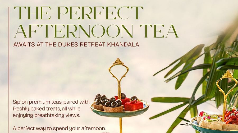 Afternoon tea setup with elegant teapots, cups, and a three-tier stand filled with colorful macarons, pastries, and savory treats at The Dukes Retreat Khandala