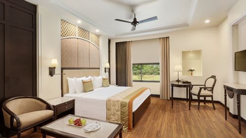 Premium Room at La Place Sarovar Portico Lucknow, lucknow featuring a bed, a chair, a work desk and chair, and a flat TV screen.