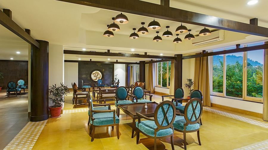 Lobby view with chairs in the centre of the room with a table in the middle - Aloha On The Ganges, Rishikesh