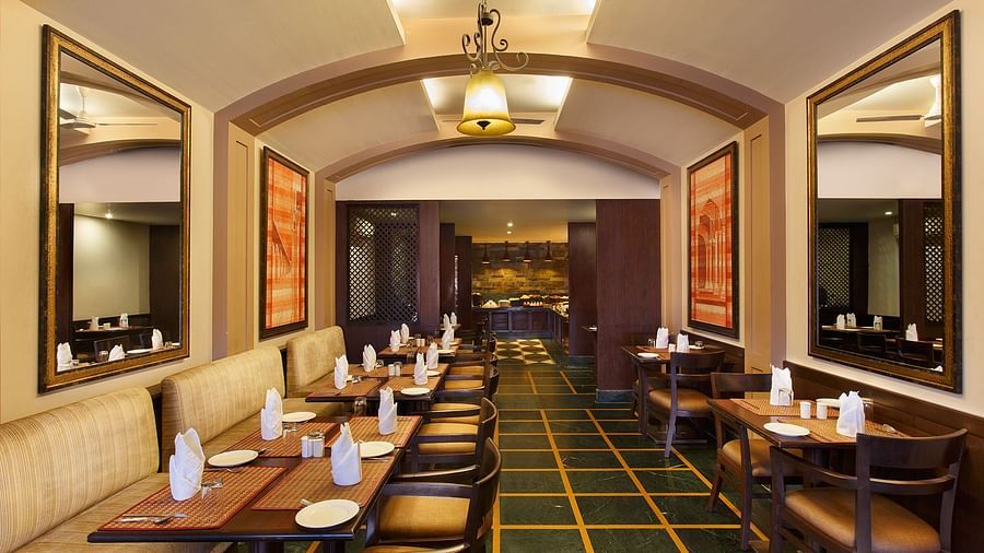 tables with chairs lined up inside a restaurant - Ganga Lahari, Haridwar