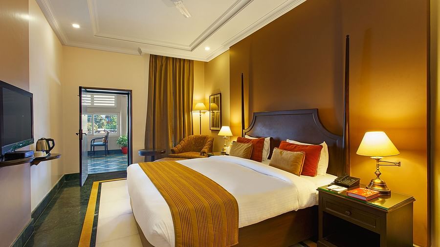 Superior Rooms with side drawers and side lamps and a large bed - Ganga Lahari Haridwar