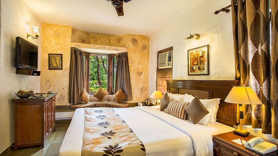 An image of a bedroom with king size bed, wooden ceiling where a fan is hanged,  cabinet and tables, etc. - The Riverview Retreat, Corbett