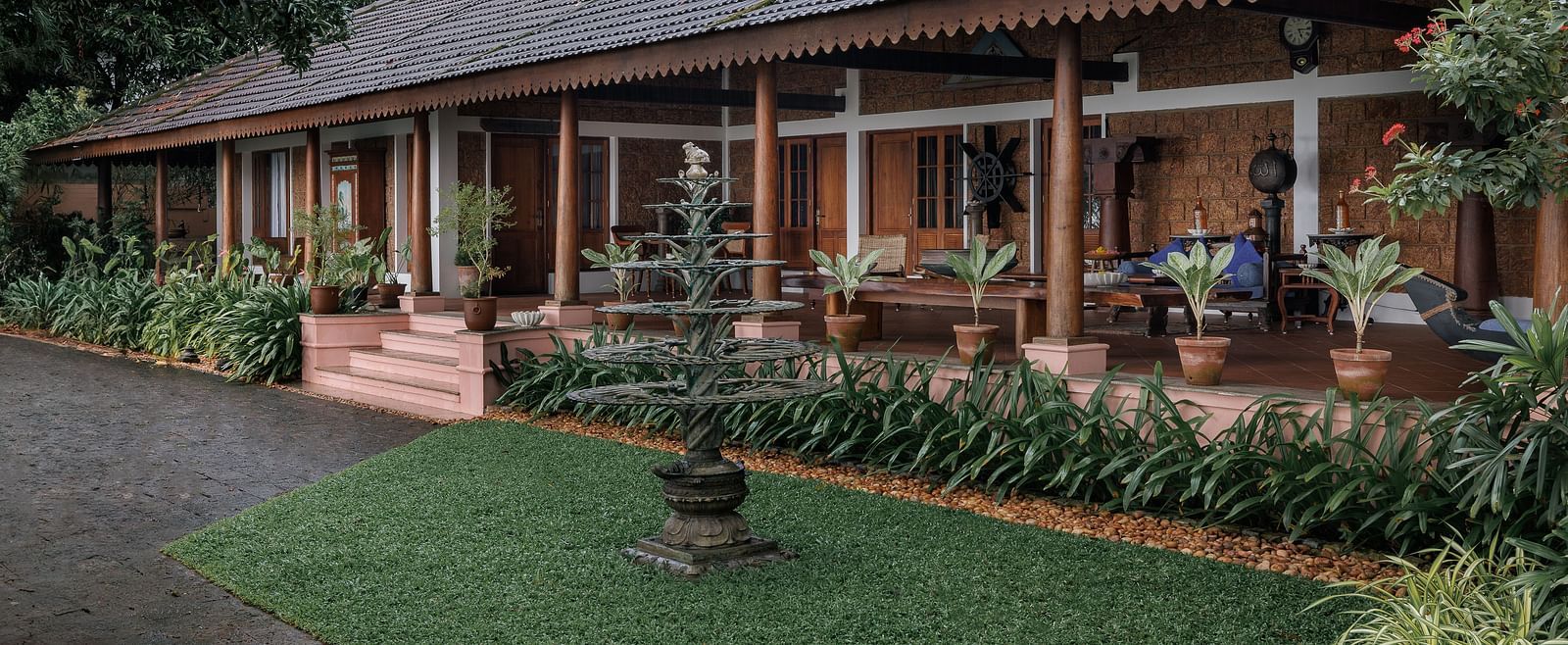 A facade of BluSalzz Villas - Muhamma Resort, Alleppey featuring the villas and greenery around it