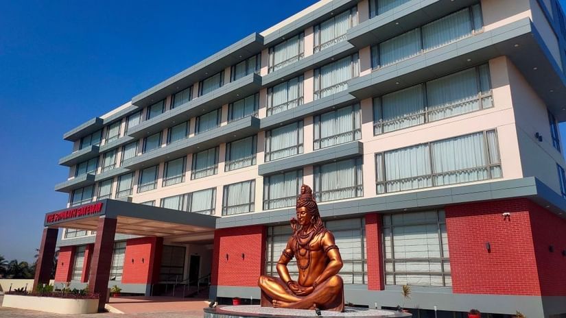 A picture of the vast hotel featuring a Lord Shiva statue at its entrance