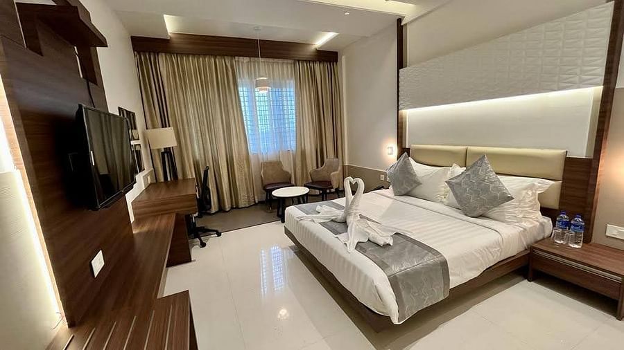 A full view of Deluxe Double Room with a double bed and bedding