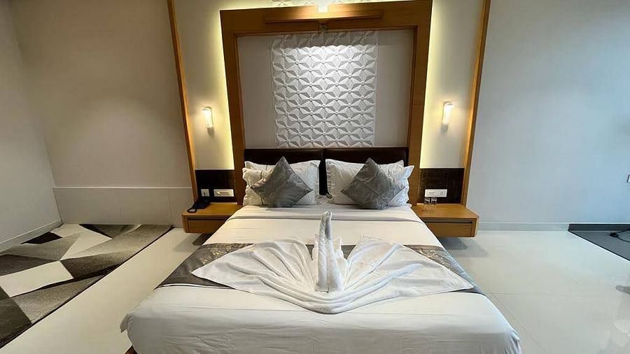 A front view of a double bed in a spacious room