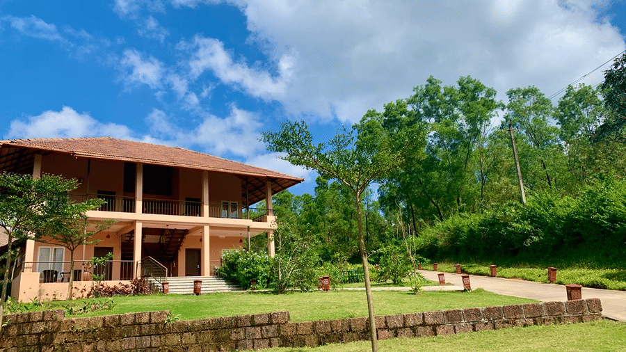Facade with trees and plants around the place | Machaan Plantation Resort, Sakleshpur